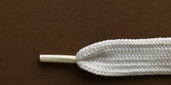 Die Geschichte der Aglets: Kleine Details, die bei Ihren Schnürsenkeln den Unterschied machen
